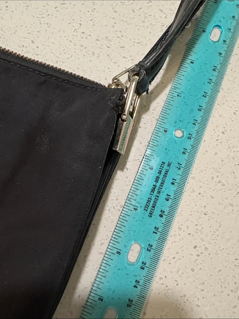 kate spade black crossbody pouch with gold-tone logo